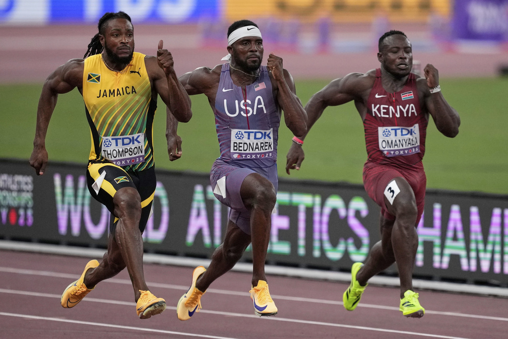 United States' Kenneth Bednarek, Jamaica's Kishane Thompson and Kenya's Ferdinand Omanyala race in a men's 100 meters semifinal at the World Athletics Championships in Tokyo, Sunday, Sept. 14, 2025. (AP Photo/Louise Delmotte)