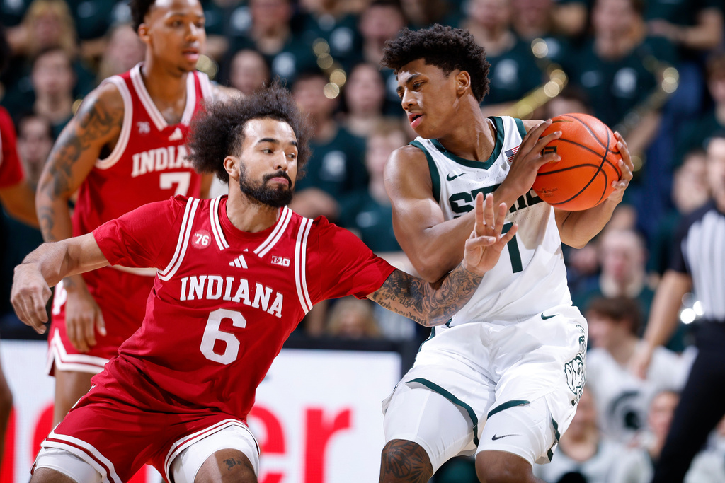Michigan State guard Jeremy Fears Jr., right, is pressured by Indiana guard Tayton Conerway (6) during the first half of an NCAA college basketball game, Tuesday, Jan. 13, 2026, in East Lansing, Mich. (AP Photo/Al Goldis)