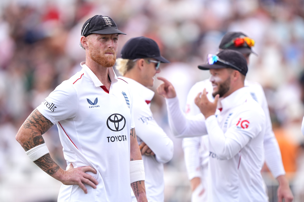 England's Ben Stokes, left looks on with teammates on day four of the Third Test cricket match between England and New Zealand, in Nottingham, England, Sunday June 28, 2026. (Joe Giddens/PA via AP)