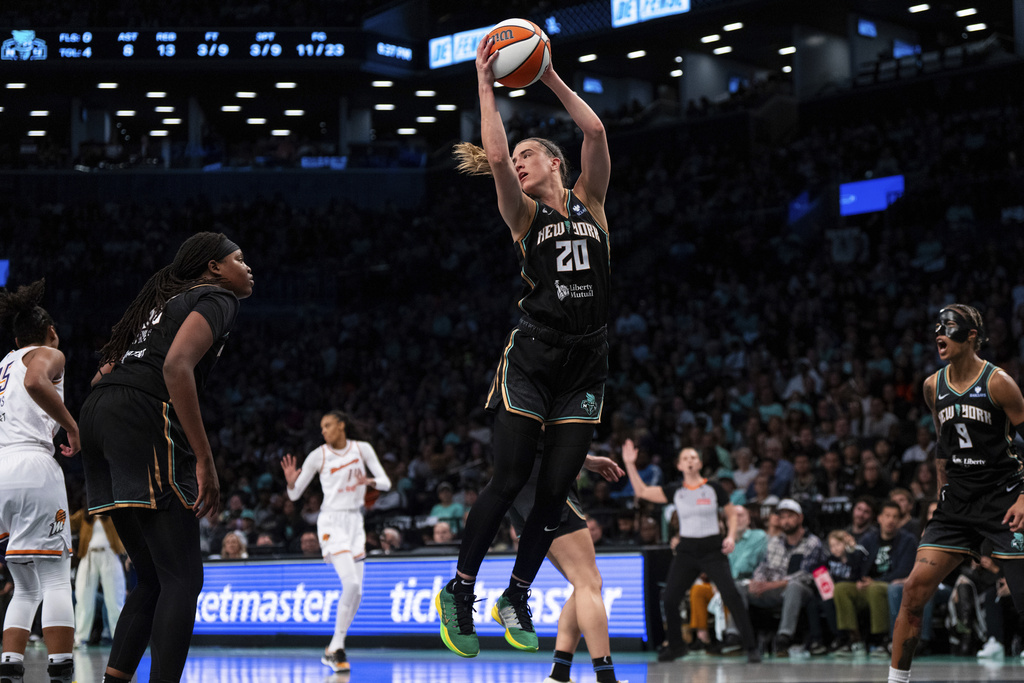 New York Liberty guard Sabrina Ionescu (20) catches a rebound ball during Game 2 in the first round of the WNBA basketball playoffs against the Phoenix Mercury, Wednesday, Sept. 17, 2025, in New York. (AP Photo/Angelina Katsanis)