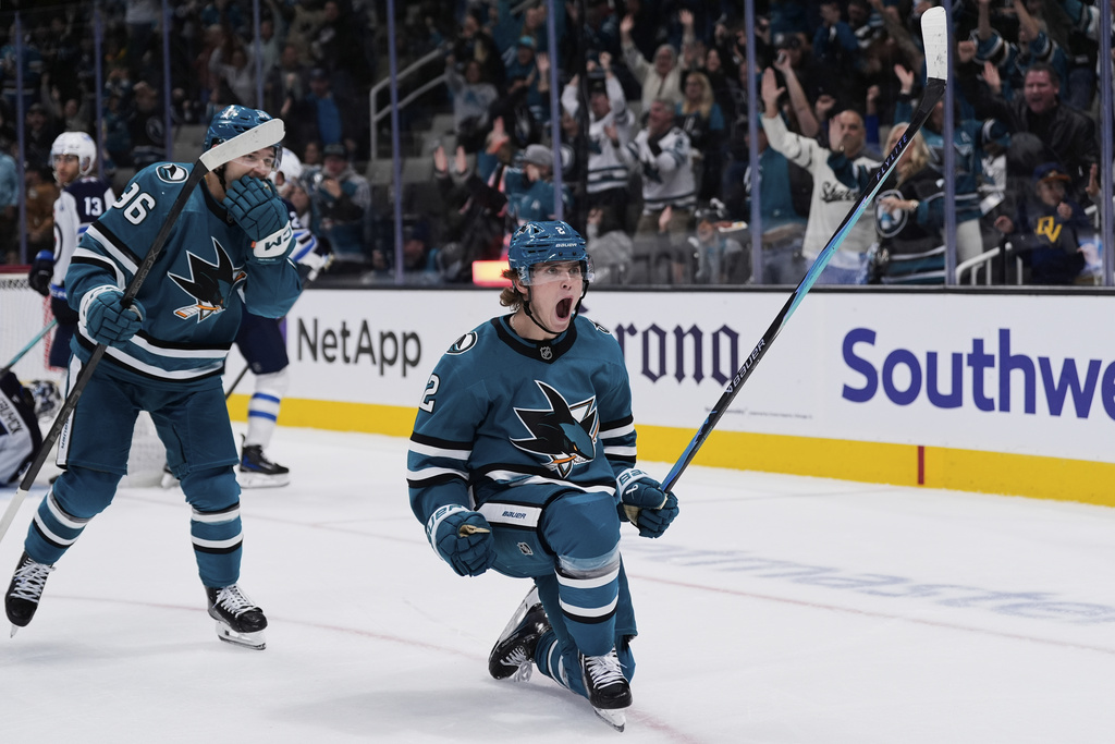 San Jose Sharks center Will Smith celebrates after scoring a goal against the Winnipeg Jets during the third period of an NHL hockey game, Friday, Nov. 7, 2025, in San Jose, Calif. (AP Photo/Godofredo A. Vásquez)