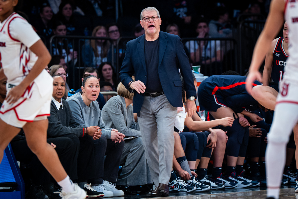 UConn head coach Geno Auriemma, center, instructs his team from the sideline during the second half of an NCAA college basketball game against St. John's, Sunday, March 1, 2026, in New York. (AP Photo/Angelina Katsanis)