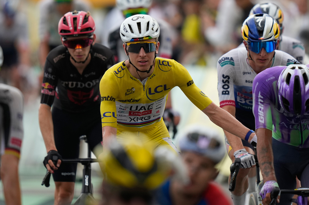 Slovenia's Tadej Pogacar, wearing the overall leader's yellow jersey crosses the finish line of the twelfth stage of the Tour de France cycling race with start in Circuit Nevers Magny-Cours and finish in Chalon-sur-Saone, France, Thursday, July 16, 2026. (AP Photo/Mosa'ab Elshamy)
