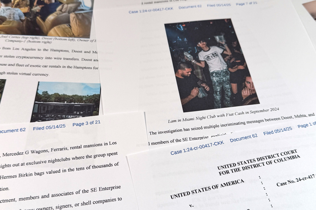 This Justice Department court filing in the case against Hamza Doost and Kunal Mehta, that includes a photo of Malone Lam, is photographed Friday, Sept. 4, 2026. (AP Photo/Jon Elswick)