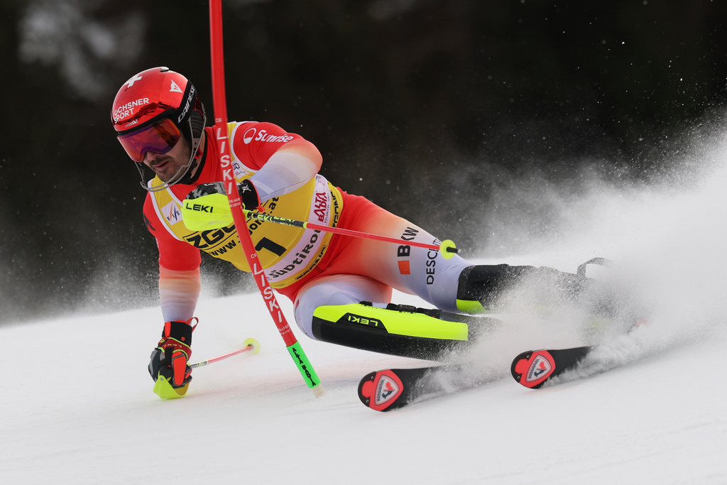 Switzerland's Loic Meillard speeds down the course during an alpine ski, men's World Cup slalom, in Alta Badia, Italy, Monday, Dec. 22, 2025. (AP Photo/Alessandro Trovati)