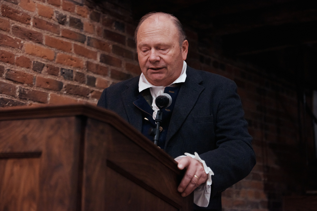 A man orates selected readings from Thomas Paine's Common Sense during an event commemorating the 250th anniversary of the pamphlet's publication at the Fraunces Tavern Museum on Saturday, Jan. 10, 2026, in New York. (AP Photo/Andres Kudacki)