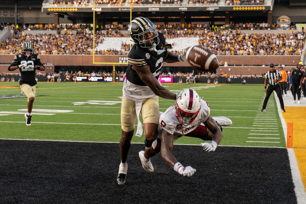 Missouri cornerback Sione Laulea (2) breaks up a pass intended to Troy wide receiver TK Keyes (8) during the first half of an NCAA college football game Saturday, Sept. 19, 2026, in Columbia, Mo. (AP Photo/LG Patterson)