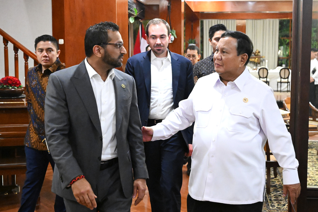 In this photo released by the Press, Media and Information Bureau of the Indonesian Presidential Secretariat, Indonesian President Prabowo Subianto, right, walks with FBI Director Kash Patel during their meeting in Jakarta, Indonesia, Wednesday, July 22, 2026. (Indonesian Presidential Secretariat via AP)