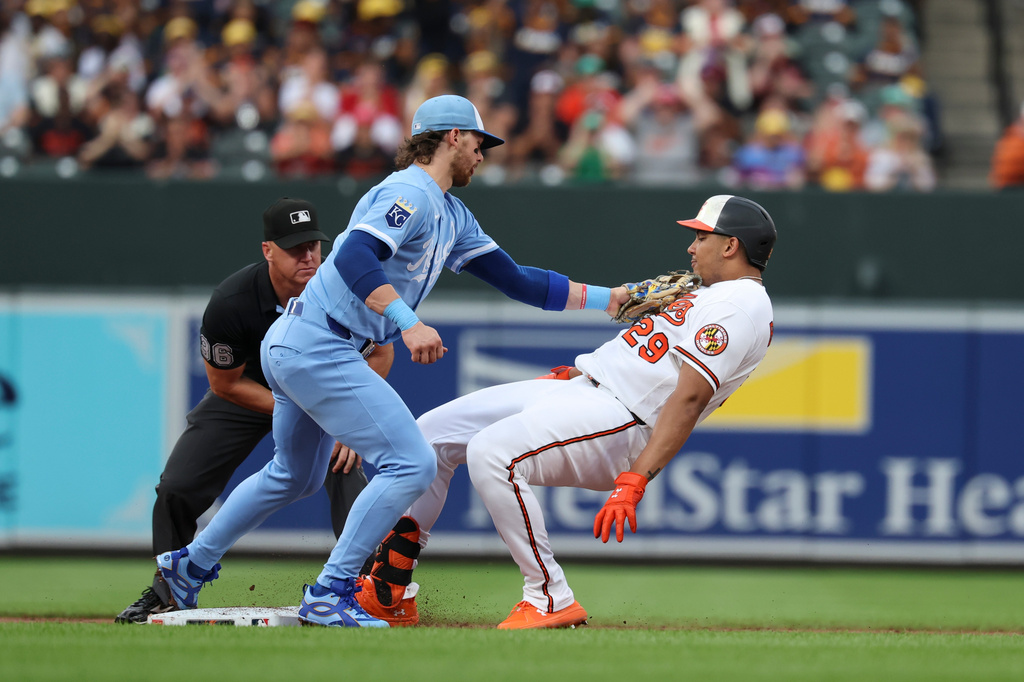 Baltimore Orioles designated hitter Samuel Basallo is tagged by Kansas City Royals shortstop Bobby Witt Jr. while attempting to advance to second base after hitting a single which drove in Pete Alonso hit off of pitcher Noah Cameron during the second inning of a baseball game, Saturday, July 11, 2026, in Baltimore. (AP Photo/Terrance Williams)