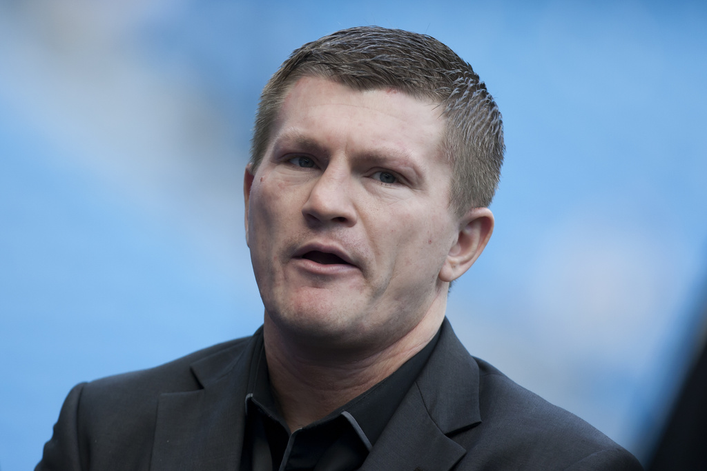 FILE - Boxer Ricky Hatton stands by the pitch before Manchester City's English Premier League soccer match against Manchester United at the Etihad Stadium, Manchester, England, Sunday Sept. 22, 2013. (AP Photo/Jon Super, File)