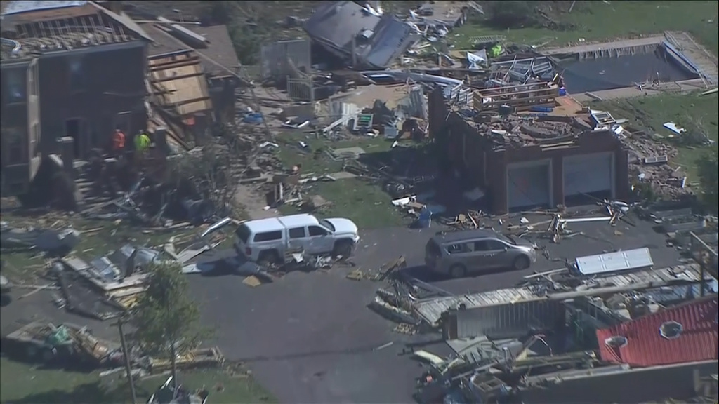 This photo made from video provided by WLS shows an aerial view of storm damage and a tornado-ravaged area on Friday, June 12, 2026, in Merrillville, Ind. (WLS via AP)