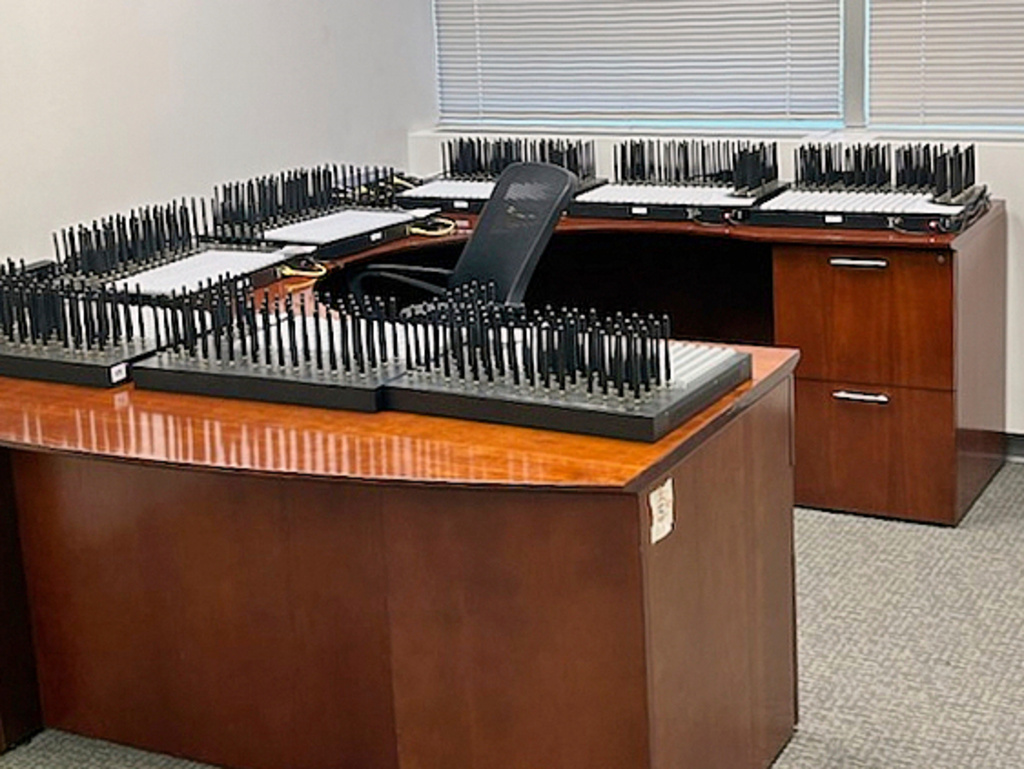 This photo provided by the U.S. Secret Service, in New York, Monday, Sept. 22, 2025, shows servers on desks at the location where they were seized by the agency. (U.S. Secret Service via AP)