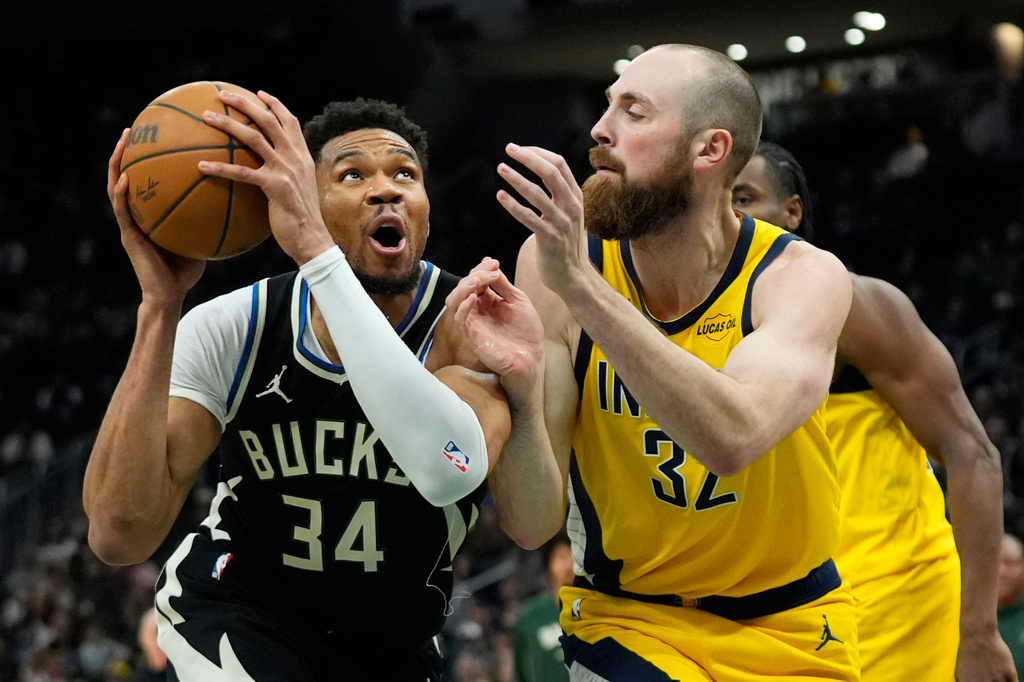 Milwaukee Bucks' Giannis Antetokounmpo (34) drives to the basket against Indiana Pacers' Jay Huff during the second half of an NBA basketball game, Sunday, March 15, 2026, in Milwaukee. (AP Photo/Aaron Gash)