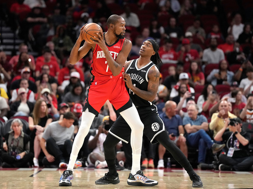 Houston Rockets forward Kevin Durant (7) controls the ball against Brooklyn Nets guard Terance Mann, right, during the first half of an NBA basketball game, Monday, Oct. 27, 2025, in Houston. (AP Photo/Karen Warren) Houston Rockets forward Kevin Durant (7) controls the ball against Brooklyn Nets guard Terance Mann, right, during the first half of an NBA basketball game, Monday, Oct. 27, 2025, in Houston. (AP Photo/Karen Warren)
