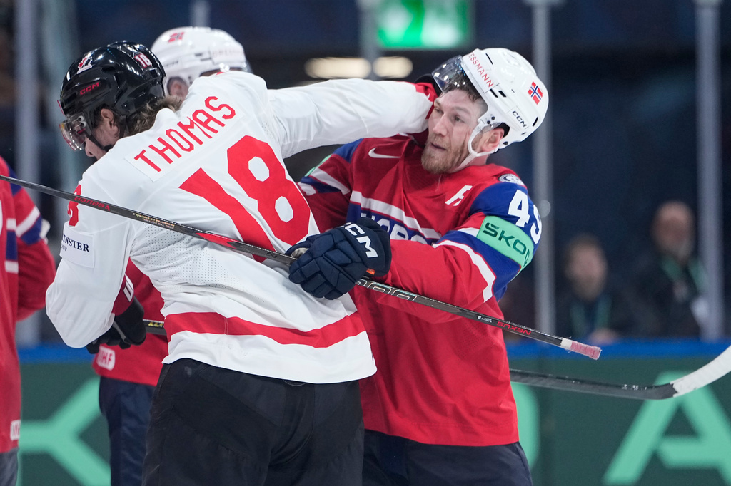 Canada's Robert Thomas (18) clashes with Norway's Christian Kaasastul (49) during the 2026 IIHF Men's Ice Hockey World Championship bronze medal match between Canada and Norway, in Zurich, Switzerland, Sunday, May 31, 2026. (AP Photo/Darko Bandic)