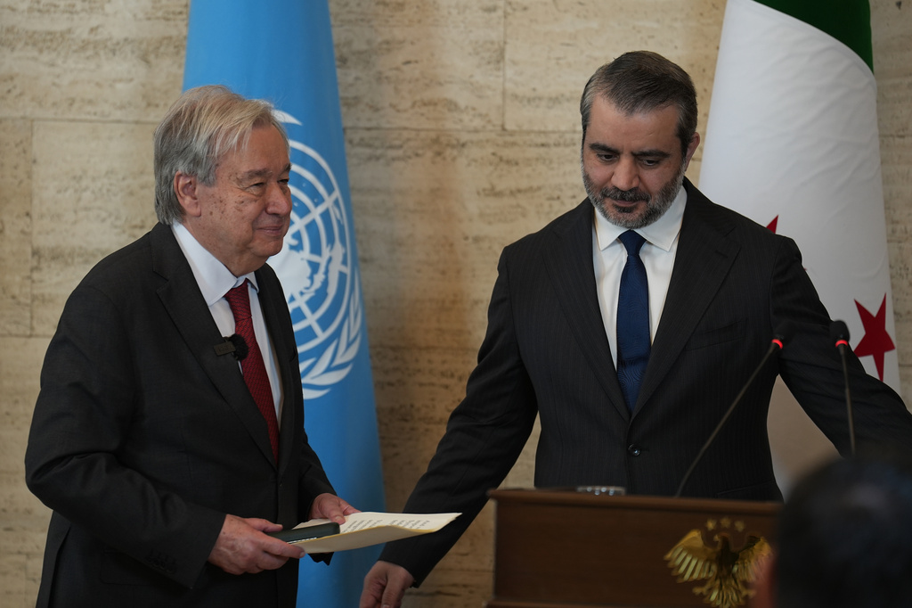 United Nations Secretary General Antonio Guterres, left, leaves after a joint press conference with Syrian Foreign Minister Asaad al-Shibani, in Damascus, Syria, Saturday, July 25, 2026. (AP Photo/Omar Albam)