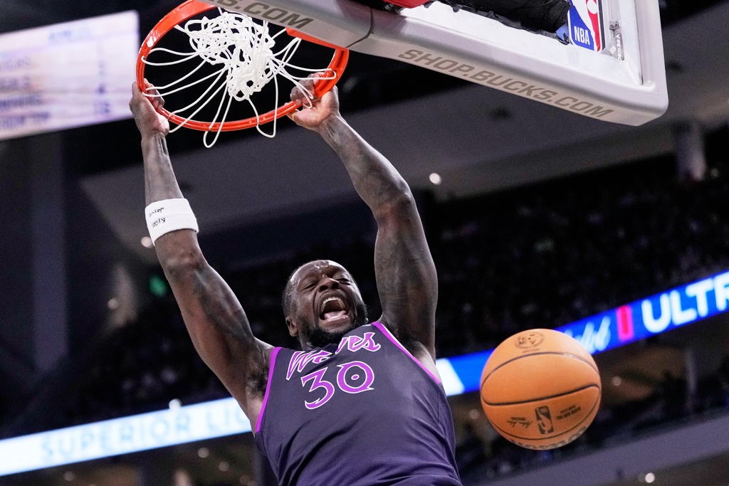 Minnesota Timberwolves' Julius Randle dunks during the first half of an NBA basketball game against the Milwaukee Bucks Tuesday, Jan. 13, 2026, in Milwaukee. (AP Photo/Morry Gash)