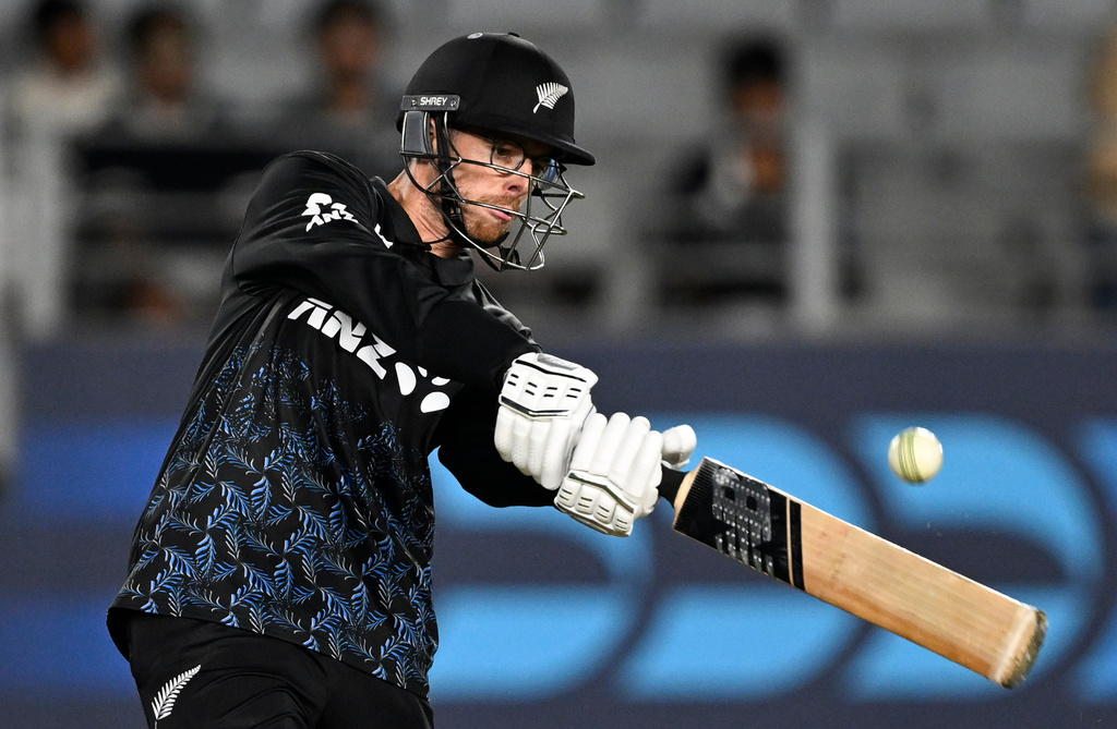 New Zealand's Mitchell Santner bats during the T20 cricket international between New Zealand and the West Indies in Auckland, New Zealand, Wednesday, Nov. 5, 2025. (Andrew Cornaga/Photosport via AP)