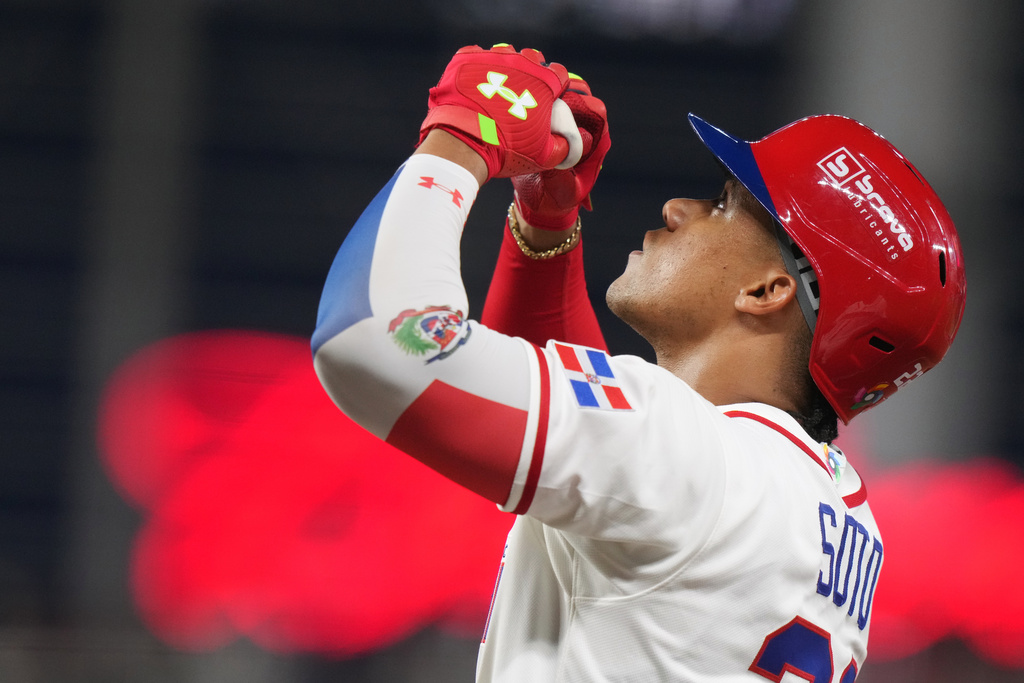 Dominican Republic's Juan Soto celebrates after hitting a single during the third inning of a World Baseball Classic quarterfinal game against South Korea, Friday, March 13, 2026, in Miami. (AP Photo/Lynne Sladky
