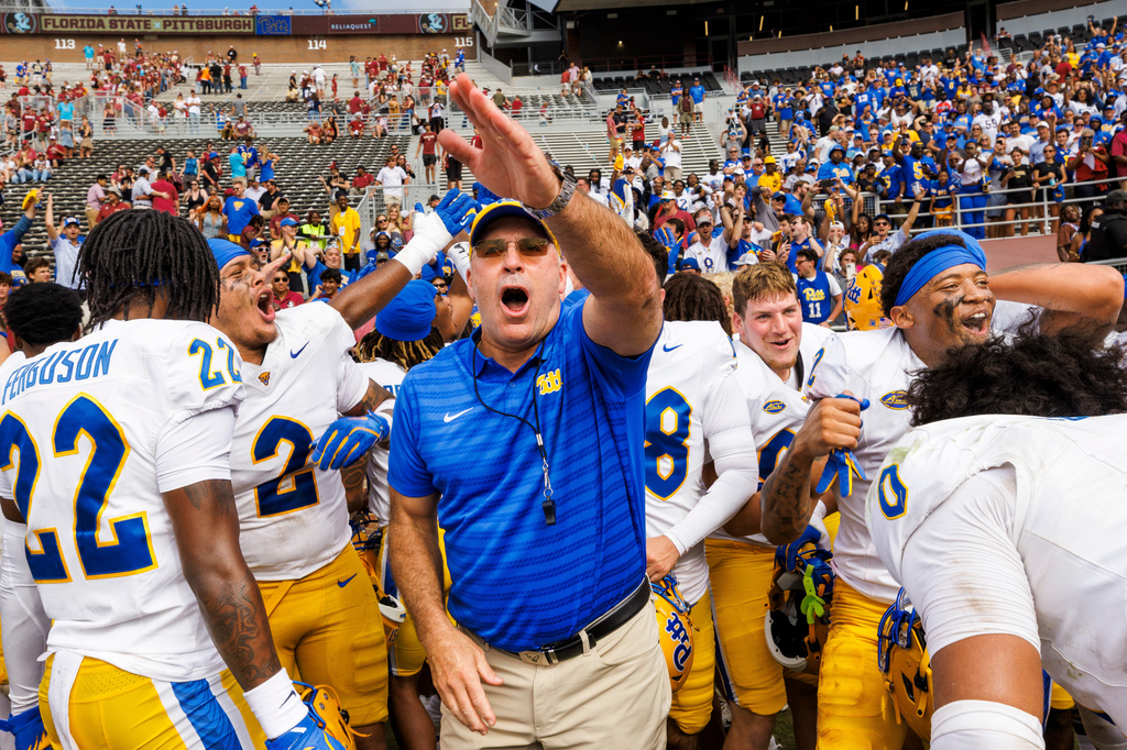 FILE - Pittsburgh head coach Pat Narduzzi, center, celebrates with his team after they defeated Florida State in an NCAA college football game, Saturday, Oct. 11, 2025, in Tallahassee, Fla. (AP Photo/Colin Hackley, file)