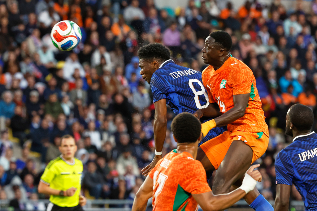 France's Aurelien Tchouameni, centre, heads the ball during the international friendly soccer match between France and Ivory Coast in Nantes, France, Thursday, June 4, 2026. (AP Photo/Jeremias Gonzalez)