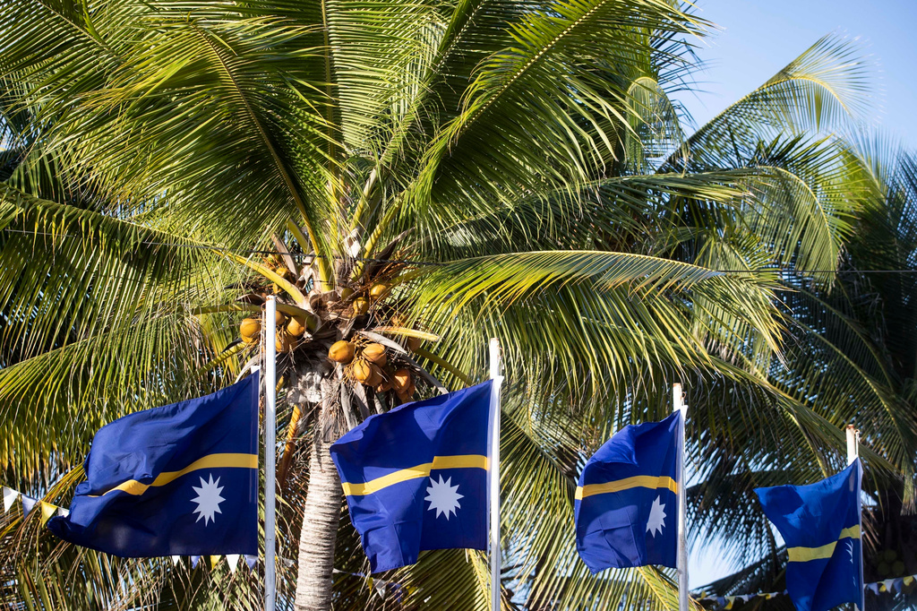 FILE - This shows national flags in Nauru for the Pacific Islands Forum on the tiny Pacific nation of Nauru, on Sept. 3, 2018. (Jason Oxenham/Pool Photo via AP, File)