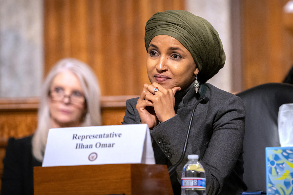 FILE - Rep. Ilhan Omar, D-Minn., listens during a Congressional spotlight hearing on Capitol Hill, Sept. 22, 2026, in Washington. (AP Photo/Mark Schiefelbein, File)