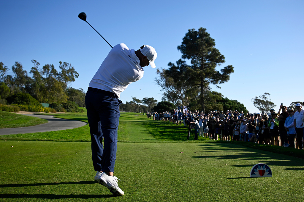 Brooks Koepka tees off on the ninth hole while playing the North Course at Torrey Pines during the second round of the Farmers Insurance Open golf tournament Friday, Jan. 30, 2026, in San Diego. (AP Photo/Denis Poroy)