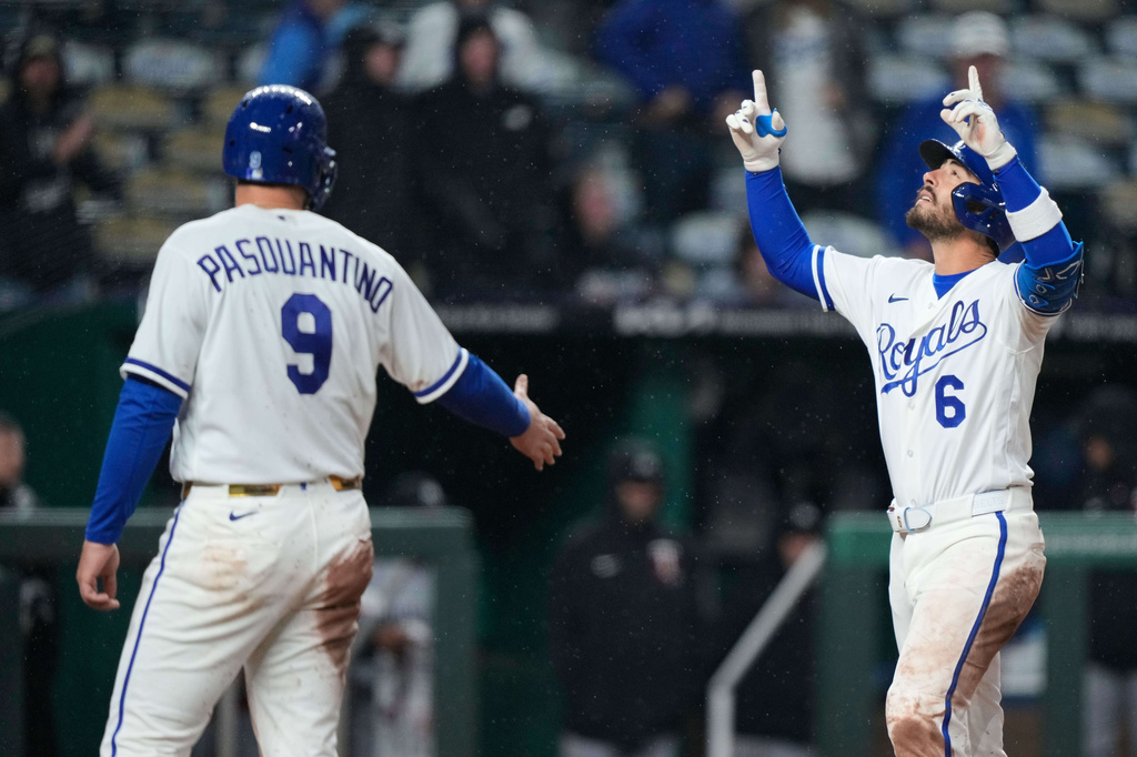 Kansas City Royals' Jonathan India (6) celebrates with Vinnie Pasquantino after hitting a grand slam during the sixth inning of a baseball game against the Minnesota Twins, Wednesday, April 1, 2026, in Kansas City, Mo. (AP Photo/Charlie Riedel)