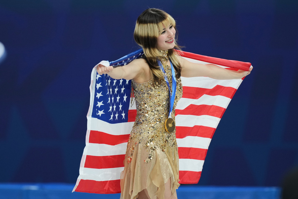 FILE - Gold medalist Alysa Liu of the United States celebrates her medal after competing in the women's free skate program in figure skating at the 2026 Winter Olympics, in Milan, Italy, Thursday, Feb. 19, 2026. (AP Photo/Stephanie Scarbrough, File)