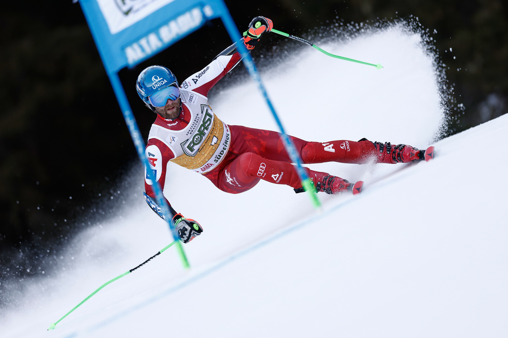 Austria's Marco Schwarz speeds down the course during an alpine ski, men's World Cup giant slalom, in Alta Badia, Italy, Sunday, Dec. 21,2025. (AP Photo/Gabriele Facciotti)