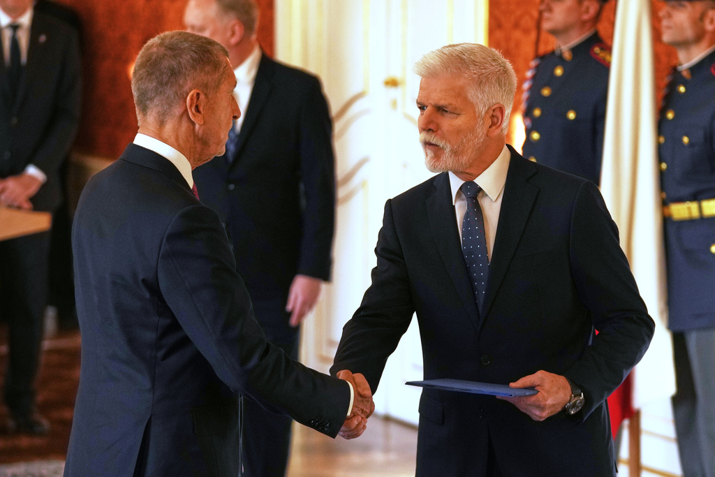 Leader of ANO political movement Andrej Babis, left, is sworn in as the country's new prime minister by Czech Republic's President Petr Pavel at the Prague Castle in Prague, Czech Republic, Tuesday, Dec. 9, 2025. (AP Photo/Petr David Josek)