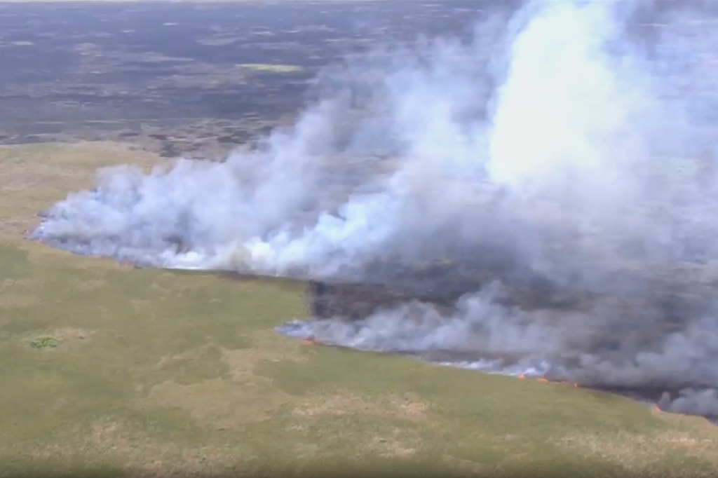 This image taken from a WSVN video a wildfire burning Wednesday, April 22, 2026, in Broward County, Fla. (WSVN/ABC Miami via AP)