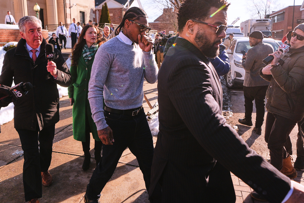 New England Patriots wide receiver Stefon Diggs leaves Norfolk County District Court after his arraignment on felony strangulation and a misdemeanor assault charges, Friday, Feb. 13, 2026, in Dedham, Mass. (AP Photo/Charles Krupa)