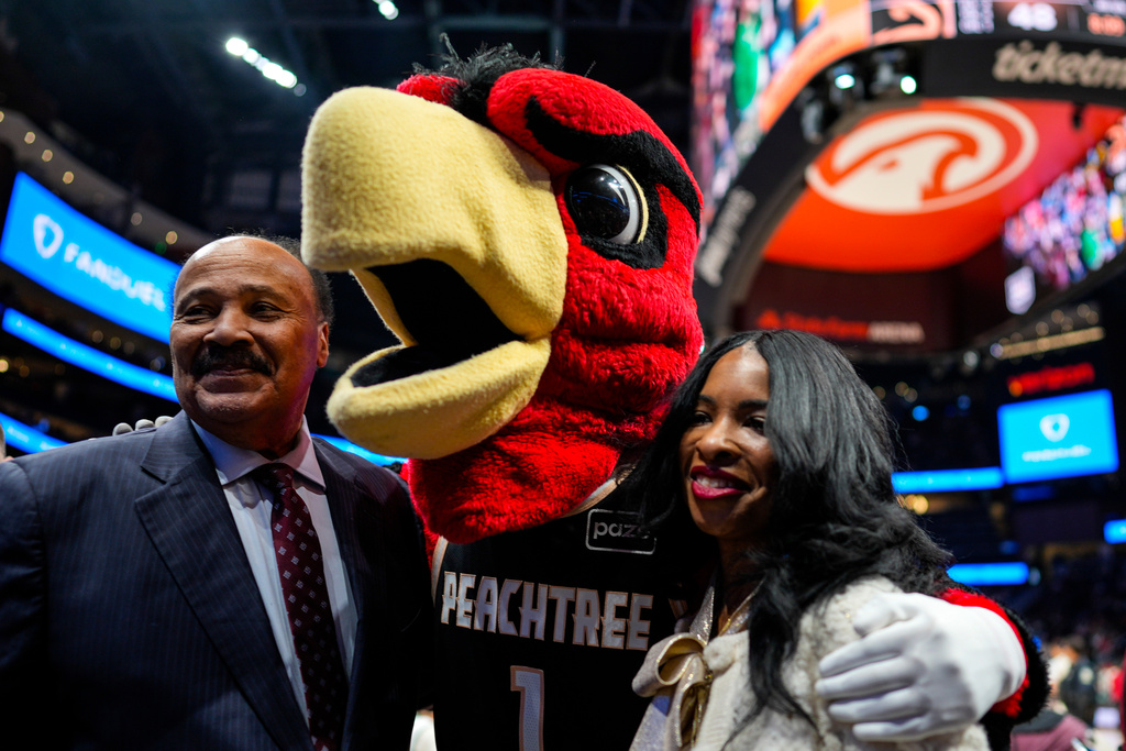 Martin Luther King III, and his wife Arndrea Waters King pose for a photo during the second half of an NBA basketball game between the Atlanta Hawks and the Milwaukee Bucks, Monday, Jan. 19, 2026, in Atlanta. (AP Photo/Mike Stewart)