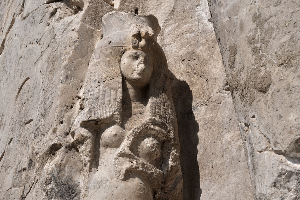 A view of the great royal Consort Tiye, near the right leg of the giant alabaster statue of Pharoah Amenhotep III, in the southern city of Luxor, Egypt, Sunday, Dec. 14, 2025. (AP Photo/Amr Nabil)