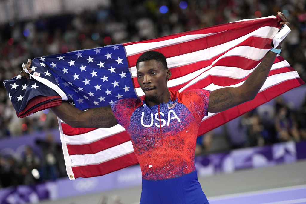 FILE - Fred Kerley, of the United States, celebrates after his third place finish in the men's 100-meter final at the 2024 Summer Olympics, on Aug. 4, 2024, in Saint-Denis, France. (AP Photo/Bernat Armangue, File)