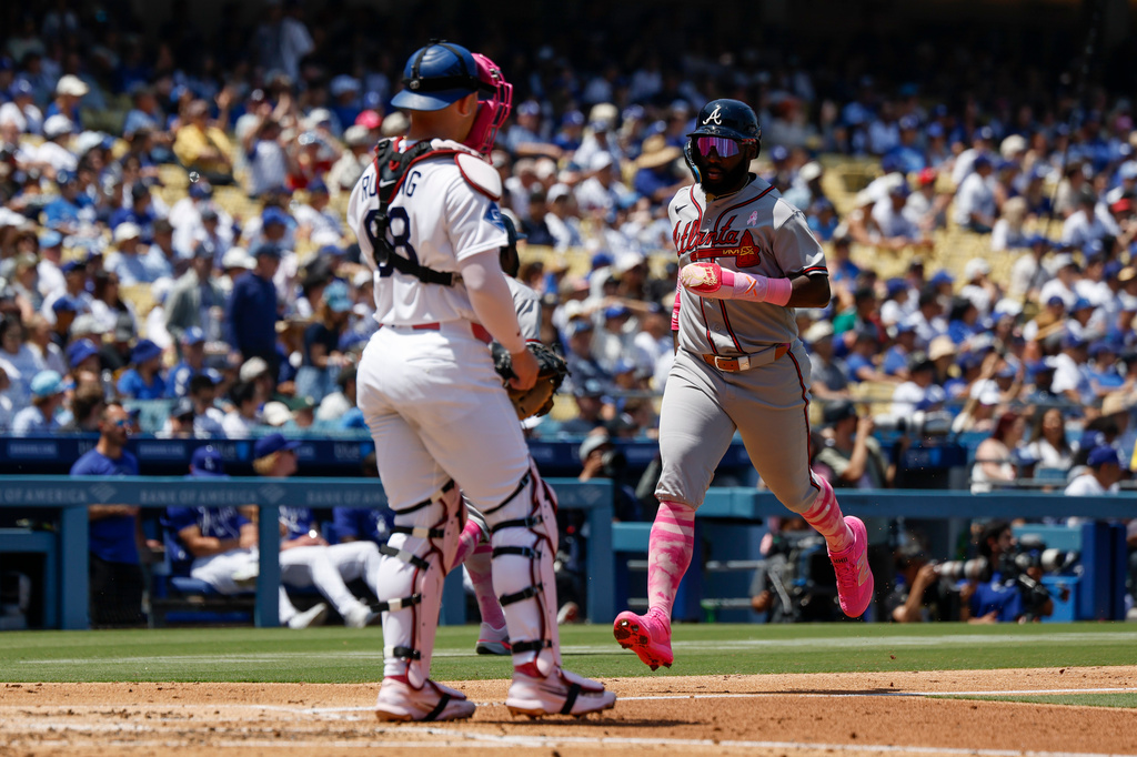 Atlanta Braves' Michael Harris II, right, runs to score on a two-run double by teammate Mauricio Dubon (not shown) during the second inning of a baseball game against the Los Angeles Dodgers, Sunday, May 10, 2026, in Los Angeles. (AP Photo/Caroline Brehman)