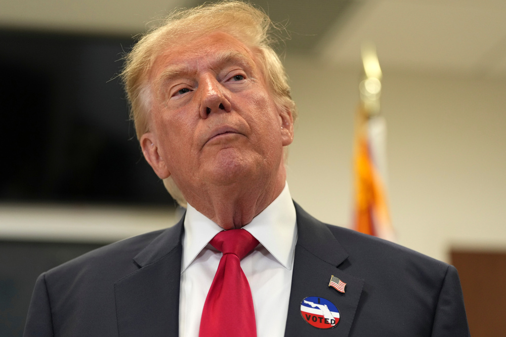 President Donald Trump listens to a question from a reporter after casting his early-voting ballot for the 2026 midterm elections at the Palm Beach County Library in West Palm Beach, Fla., Saturday, Oct. 24, 2026. (AP Photo/Mark Schiefelbein)