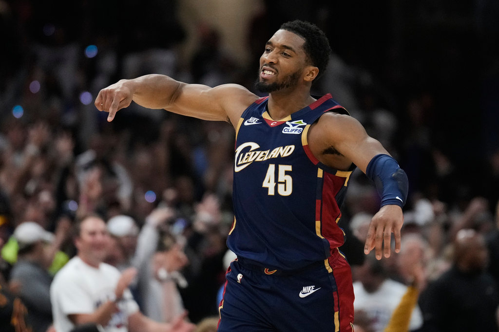 Cleveland Cavaliers' Donovan Mitchell (45) gestures after hitting a three-point basket inthe second half of Game 4 of a second-round NBA basketball playoff series against the Detroit Pistons Monday, May 11, 2026, in Cleveland. (AP Photo/Sue Ogrocki)