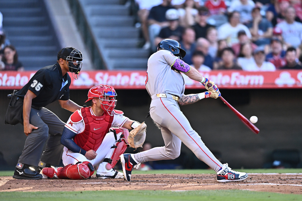 Boston Red Sox's Jarren Duran, right, hits a two-run home run during the second inning of a baseball game against the Los Angeles Angels, Sunday, July 5, 2026, in Anaheim, Calif. (AP Photo/William Liang)