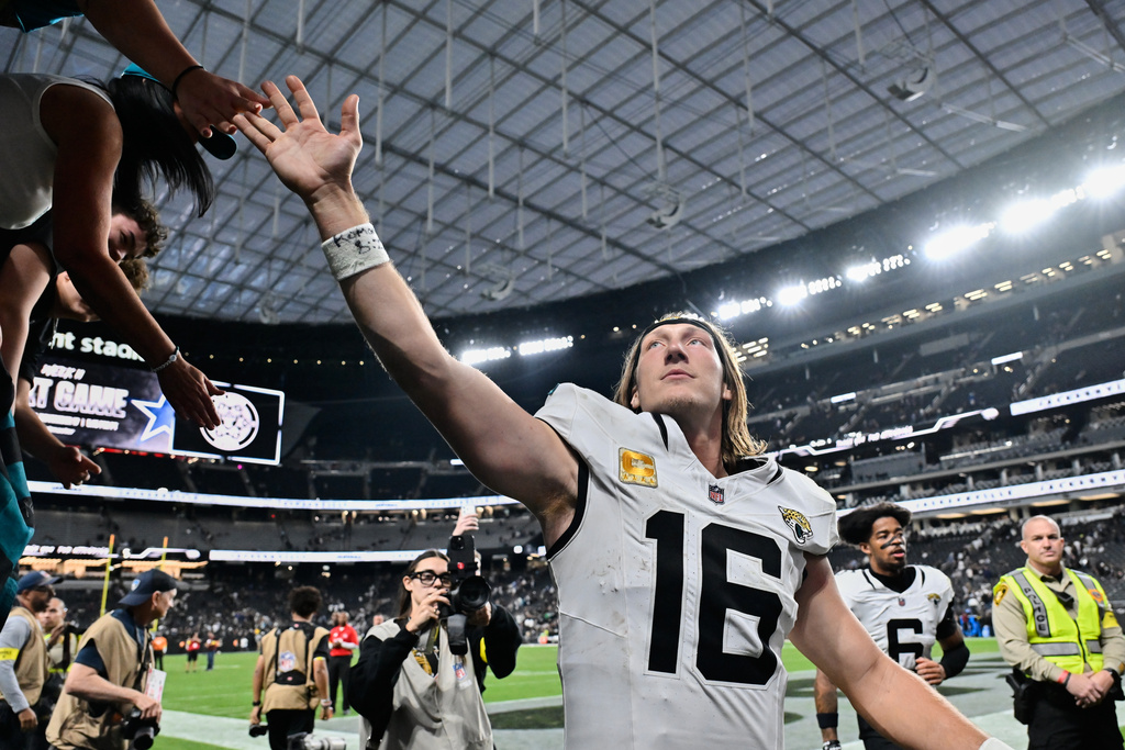 Jacksonville Jaguars quarterback Trevor Lawrence (16) exits the field after the team's victory over the Las Vegas Raiders in an NFL football game, Sunday, Nov. 2, 2025, in Las Vegas. (AP Photo/David Becker)