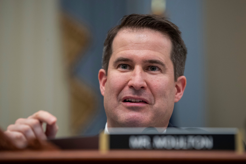 FILE - Rep. Seth Moulton, D-Mass., questions Office of Management and Budget Acting Director Russell Vought as he testifies during a hearing of the House Budget Committee on Capitol Hill, Feb. 12, 2020, in Washington. (AP Photo/Alex Brandon, File)