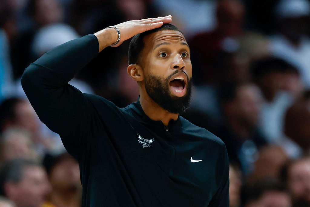 Charlotte Hornets head coach Charles Lee calls a play during the first half of an NBA play-in tournament basketball game against the Miami Heat in Charlotte, N.C., Tuesday, April 14, 2026. (AP Photo/Nell Redmond)