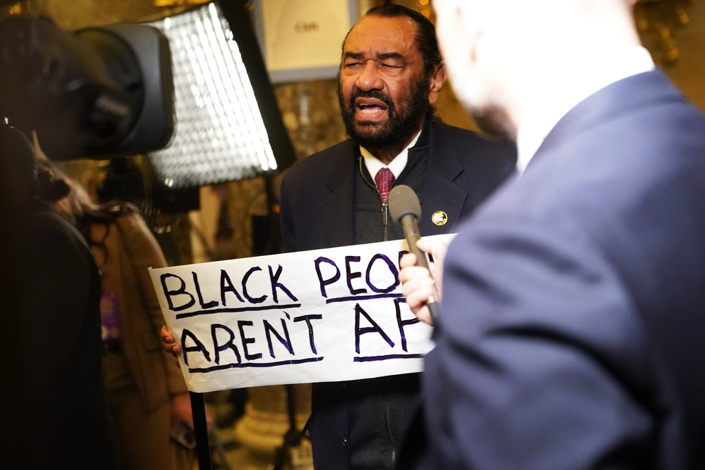 Rep. Al Green, D-Texas, speaks to the press after being escorted out of President Donald Trump's State of the Union address to a joint session of Congress in the House chamber at the U.S. Capitol in Washington, Tuesday, Feb. 24, 2026. (AP Photo/Allison Robbert)