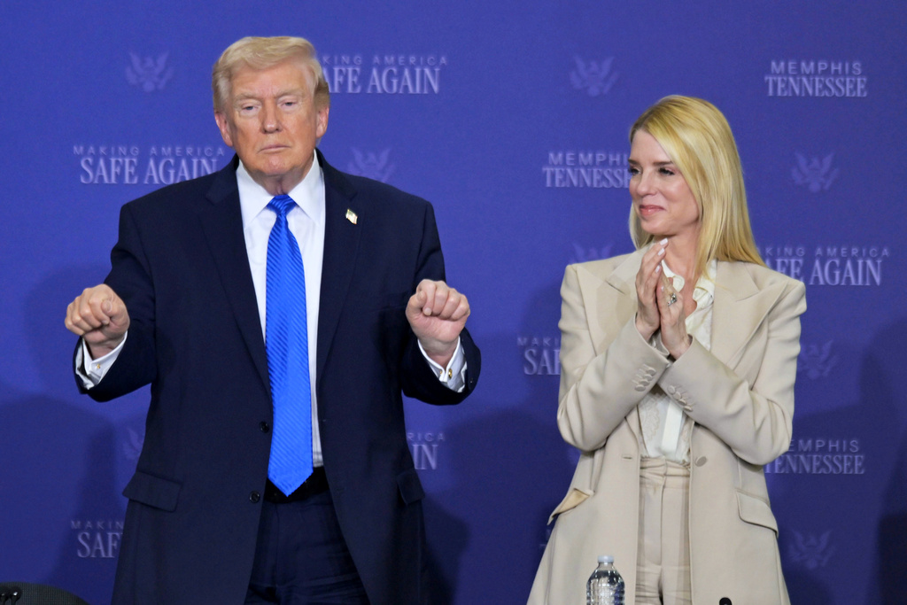President Donald Trump participates in a roundtable discussion on public safety at a Tennessee Air National Guard Base, Monday, March 23, 2026, in Memphis, Tenn., with Attorney General Pam Bondi, right. (AP Photo/Bruce Newman)