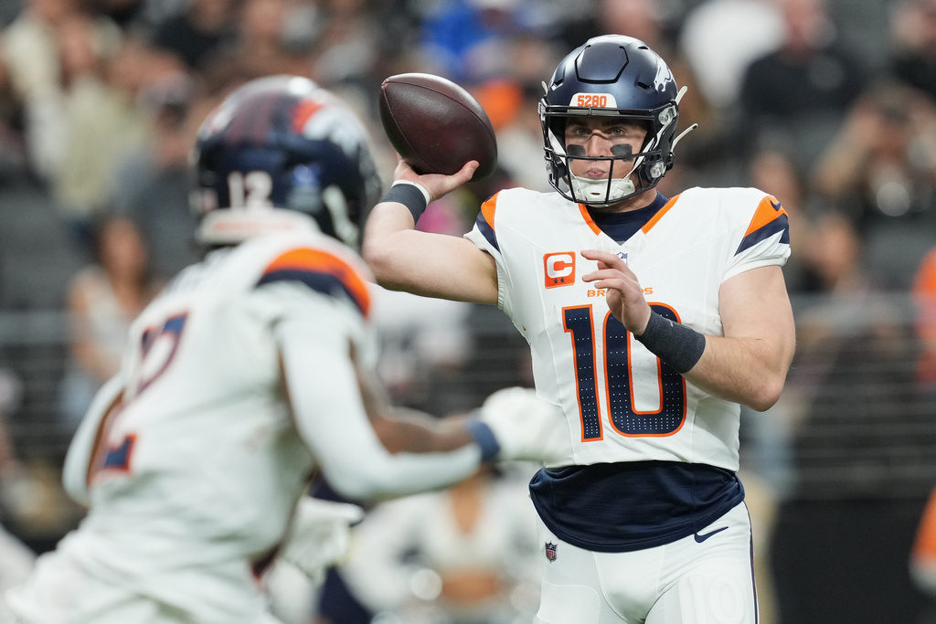 Denver Broncos quarterback Bo Nix (10) passes against the Las Vegas Raiders during the first half of an NFL football game in Las Vegas, Sunday, Dec. 7, 2025. (AP Photo/Candice Ward)