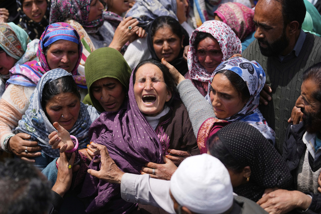 Relatives wail during the funeral procession of Adil Hussain Shah, a daily-wage worker, who died when militants indiscriminately opened fire on a crowd of mainly tourists on Tuesday, at his village Hapatnar, about 20 km (13 miles) from Pahalgam where the incident took place, Indian controlled Kashmir, Wednesday, April 23, 2025. (AP Photo/Dar Yasin)