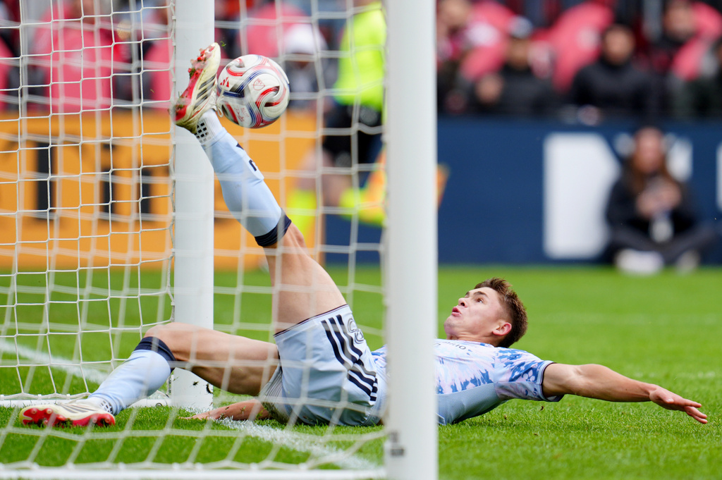San Jose Earthquakes defender Reid Roberts (18) slides in to save a goal by the Toronto FC during the second half of an MLS soccer game in Toronto, Saturday, May 2, 2026. (Frank Gunn/The Canadian Press via AP)