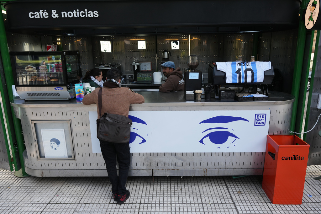 A Lionel Messi T-shirt hangs at a coffee shop as Argentina faces Austria for a World Cup match, in Buenos Aires, Argentina, Monday, June 22, 2026. (AP Photo/Gustavo Garello)